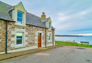 Image of the front of Hill Crest showing the sea in Cullen Bay
